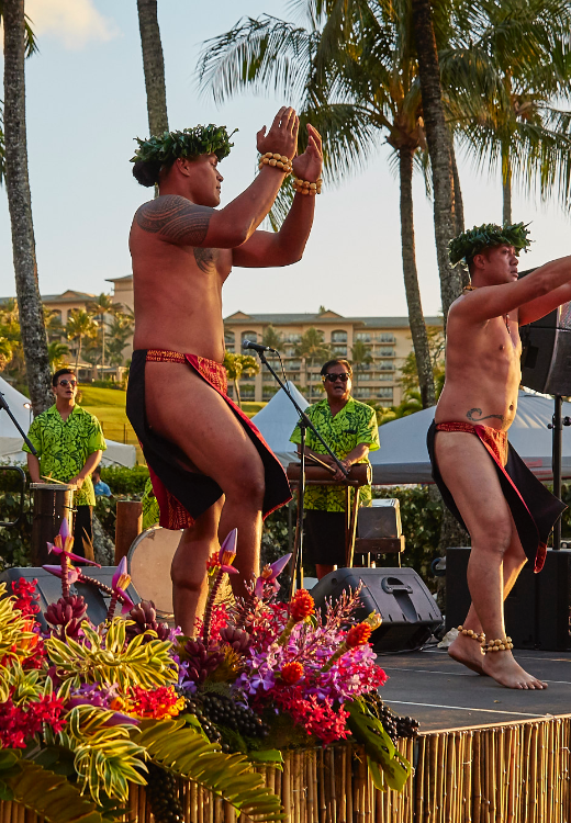 Hawaiian dancers performing traditional song and dance